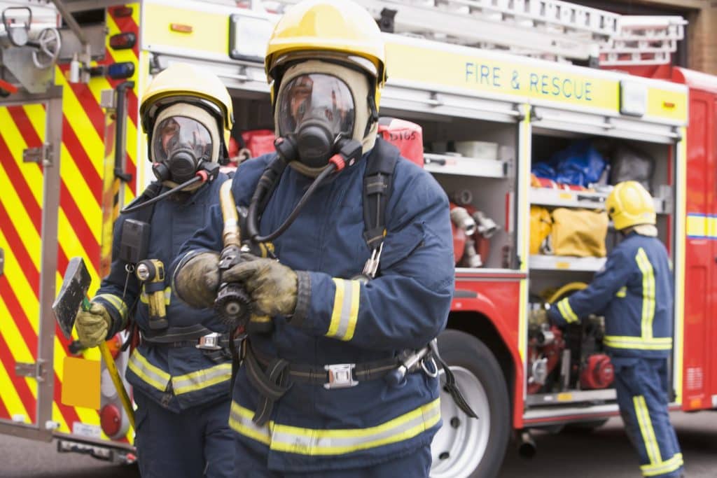 Firefighters wearing protective clothing with high performance technical webbing