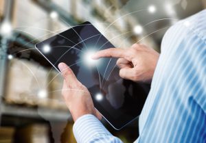 Man Using tablet In Warehouse